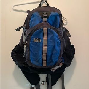 REI Blue and Black daypack with Padded Straps and Durable Design